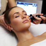 the girl lies with her eyes closed during the procedure